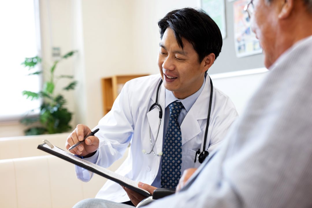 Doctor shows clipboard to patient