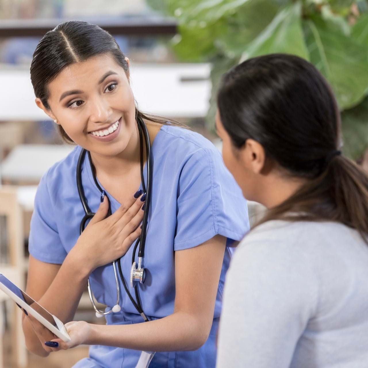 Nurse speaking with patient