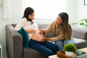 Pregnant woman and midwife