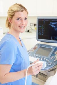 Nurse with ultrasound machine